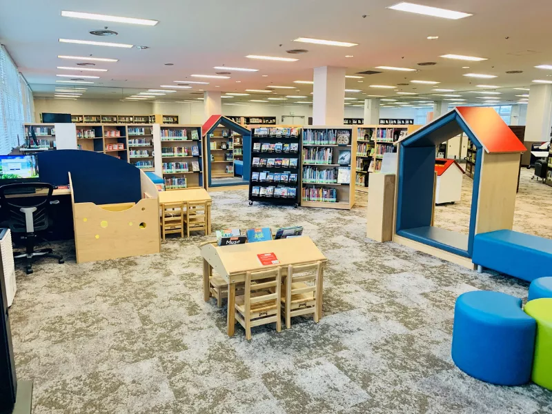 Welcome to Your Library: Image of colorful shelving and furniture in the Camp Foster Library Children's Area, Okinawa, Japan.
